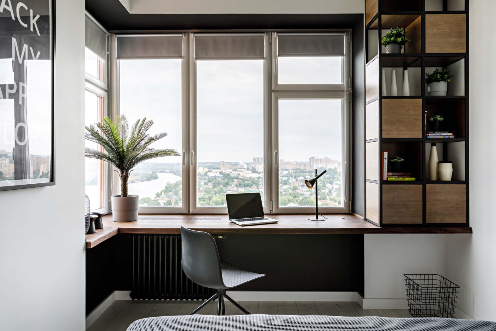 Scandinavian home office in Moscow with white walls, no fireplace, a built-in desk and beige floor.