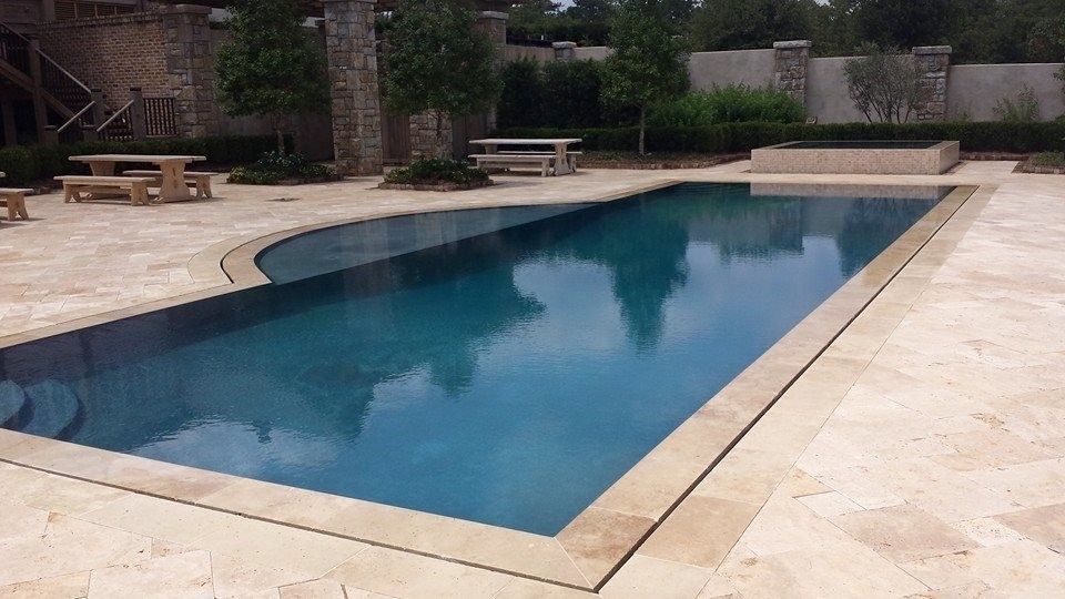 Photo of a mid-sized contemporary backyard rectangular natural pool in Miami with concrete pavers and a hot tub.
