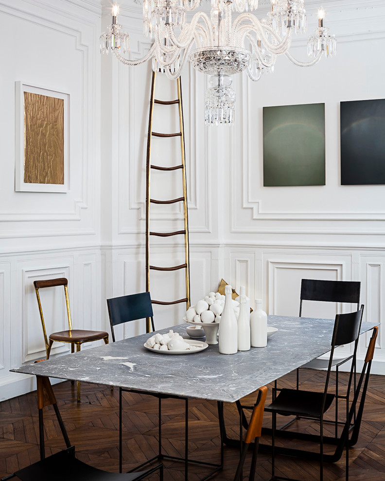 Design ideas for a mid-sized transitional open plan dining in Paris with white walls and dark hardwood floors.