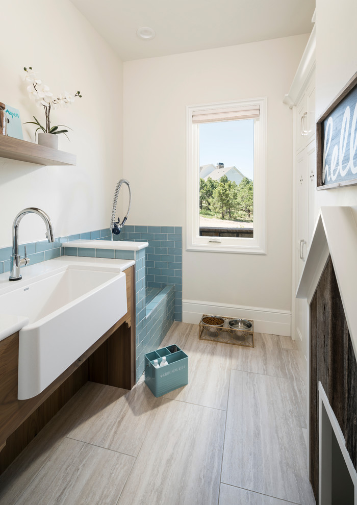Photo of a transitional bathroom in Denver with a corner tub, a corner shower, blue tile, glass tile, beige walls, a trough sink, beige floor and an open shower.