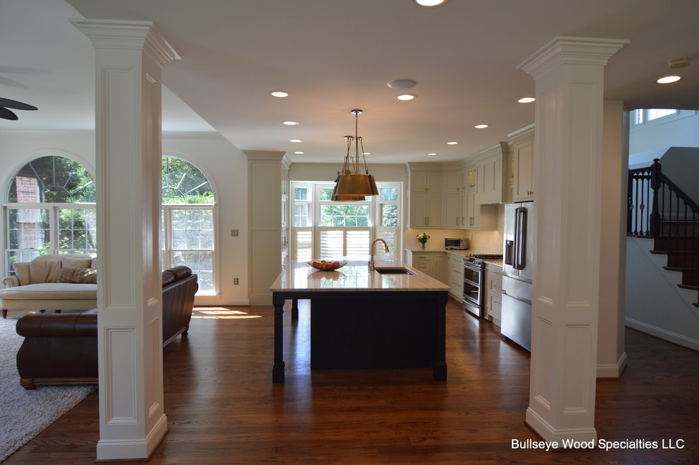 Large transitional u-shaped medium tone wood floor and brown floor eat-in kitchen photo in DC Metro with a single-bowl sink, shaker cabinets, gray cabinets, quartzite countertops, white backsplash, ceramic backsplash, stainless steel appliances, an island and white countertops
