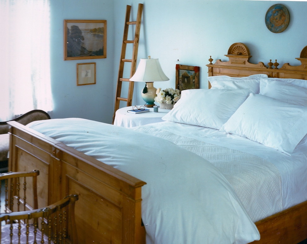 Photo of a country bedroom in New York with white walls.