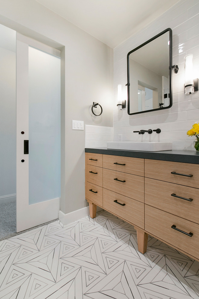 Country master bathroom in San Francisco with flat-panel cabinets, light wood cabinets, white tile, subway tile, soapstone benchtops, a double vanity and a built-in vanity.