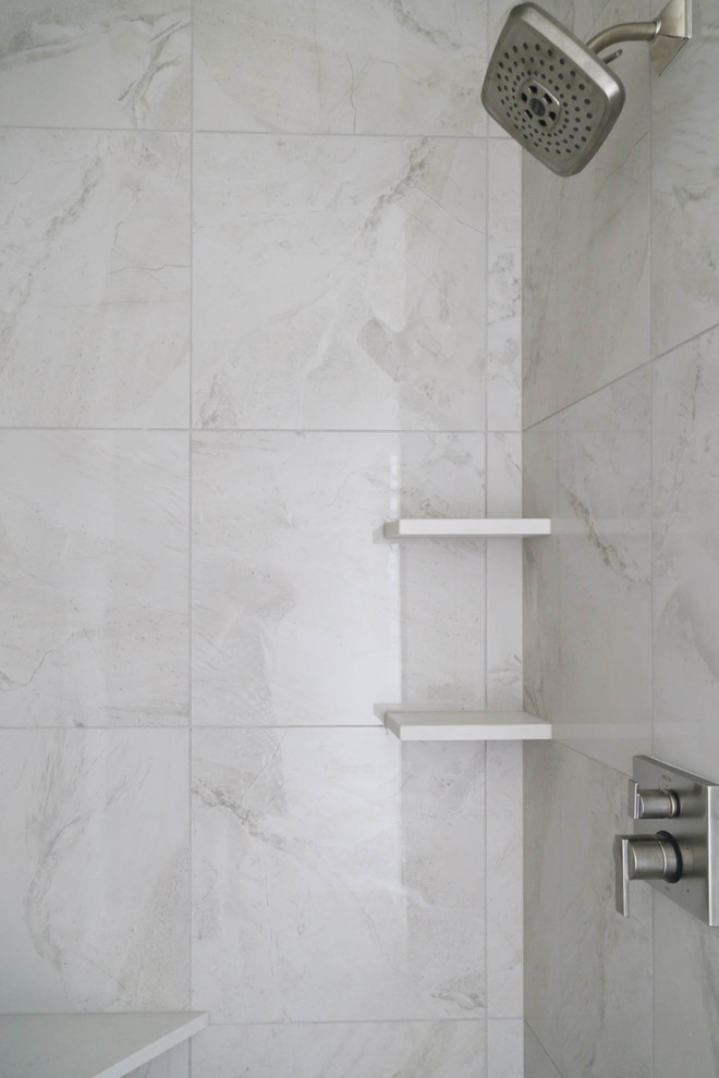 Mid-sized transitional master white tile and porcelain tile porcelain tile and white floor freestanding bathtub photo with shaker cabinets, dark wood cabinets, a two-piece toilet, gray walls, an undermount sink, quartz countertops and white countertops
