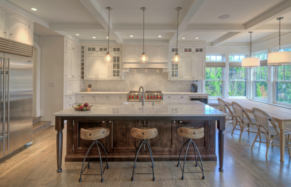 Design ideas for a large transitional l-shaped open plan kitchen in DC Metro with a farmhouse sink, recessed-panel cabinets, white cabinets, quartzite benchtops, stainless steel appliances, light hardwood floors and with island.