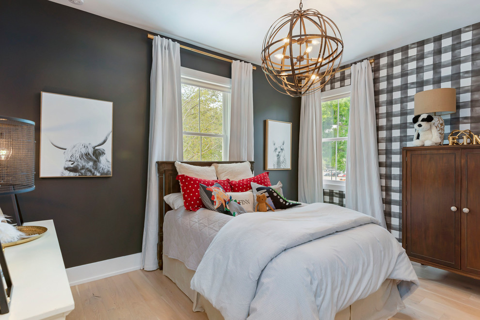 Inspiration for a mid-sized transitional kids' bedroom for kids 4-10 years old and boys in Orlando with black walls, light hardwood floors and beige floor.
