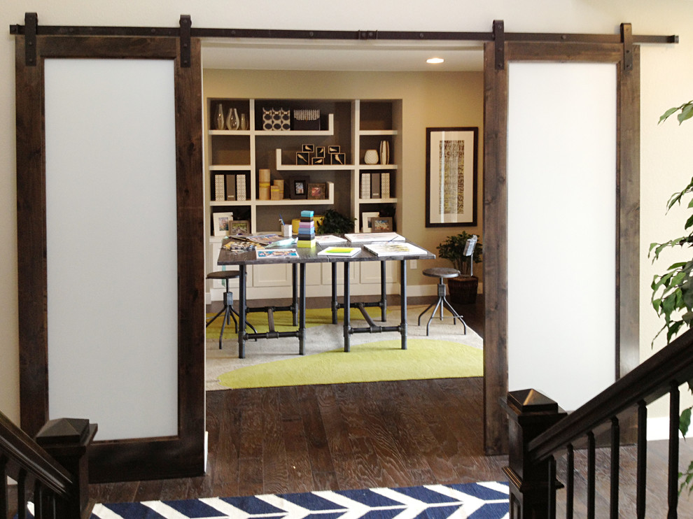 Inspiration for a mid-sized modern freestanding desk dark wood floor home studio remodel in Minneapolis with gray walls