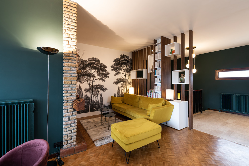Inspiration for a mid-sized midcentury open concept living room in Lyon with multi-coloured walls, medium hardwood floors, a brick fireplace surround and brown floor.