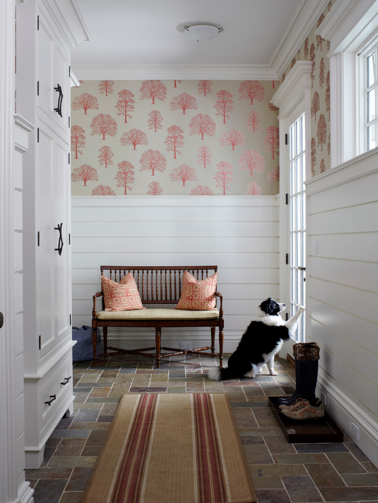 Design ideas for a traditional mudroom in New York with multi-coloured walls, a single front door and a glass front door.