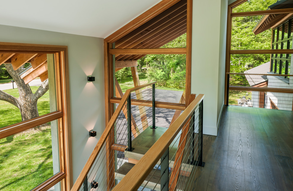 Inspiration for a mid-sized country wood u-shaped staircase in Philadelphia with open risers and cable railing.