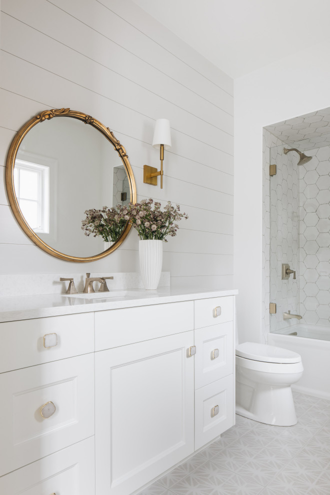 Inspiration for a large transitional kids' white tile multicolored floor, single-sink and wall paneling bathroom remodel in Chicago with recessed-panel cabinets, white cabinets, a one-piece toilet, white walls, a drop-in sink, white countertops and a freestanding vanity