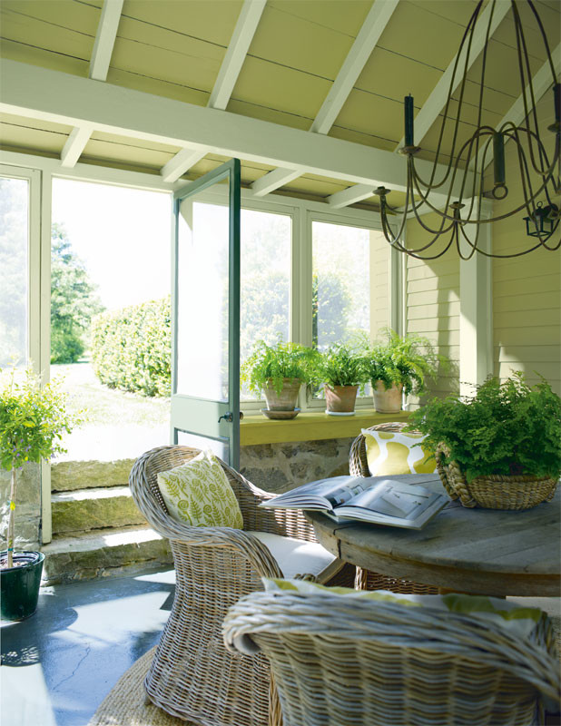 This is an example of a beach style sunroom in Portland Maine.