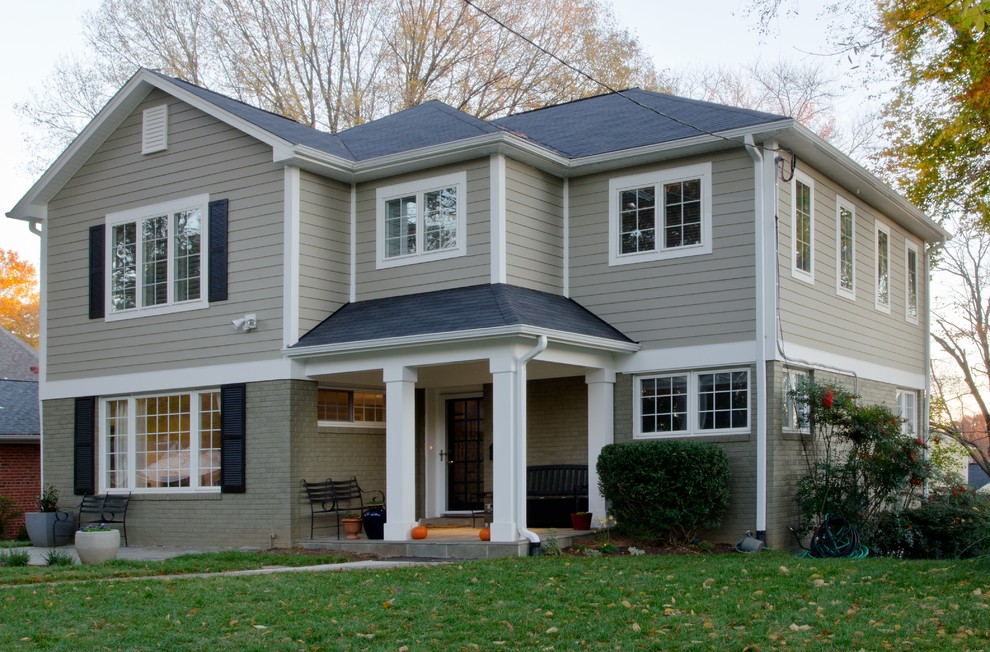 Photo of a mid-sized transitional one-storey grey exterior in DC Metro with concrete fiberboard siding and a hip roof.