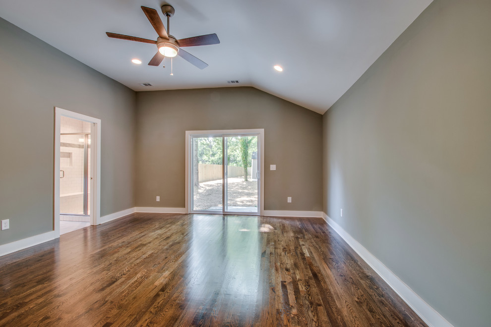 Small transitional master bedroom in Nashville with grey walls and dark hardwood floors.