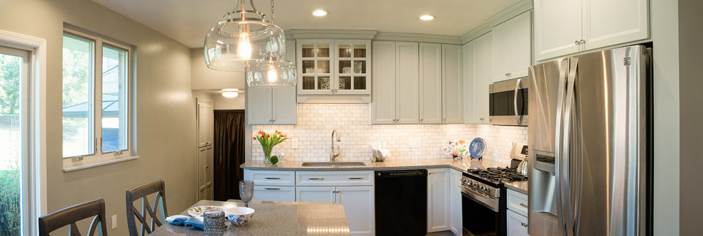 Inspiration for a mid-sized transitional l-shaped vinyl floor eat-in kitchen remodel with an undermount sink, recessed-panel cabinets, gray cabinets, quartz countertops, white backsplash, marble backsplash, stainless steel appliances and an island