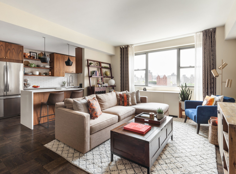 Design ideas for a transitional living room in New York with beige walls, dark hardwood floors and brown floor.