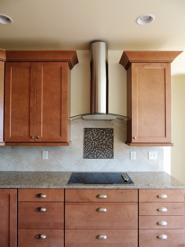 Eat-in kitchen - large transitional u-shaped light wood floor eat-in kitchen idea in Seattle with recessed-panel cabinets, medium tone wood cabinets, multicolored backsplash, mosaic tile backsplash, stainless steel appliances, an island and quartz countertops