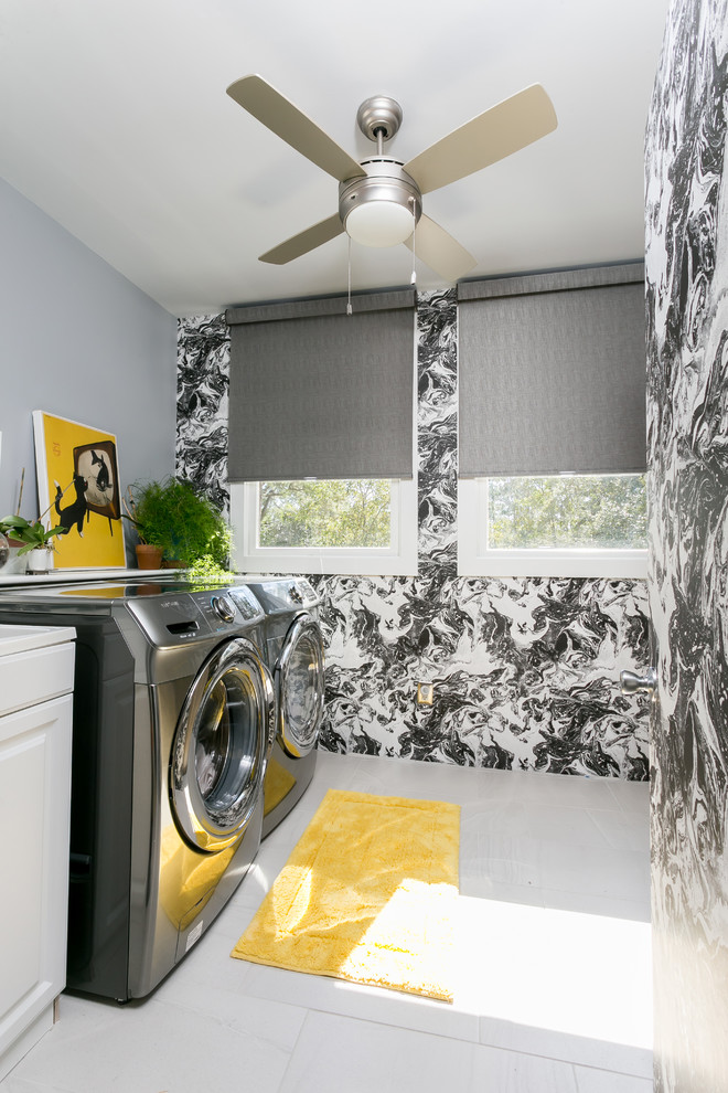 Photo of a transitional single-wall laundry room in Charleston with raised-panel cabinets, white cabinets, multi-coloured walls and a side-by-side washer and dryer.
