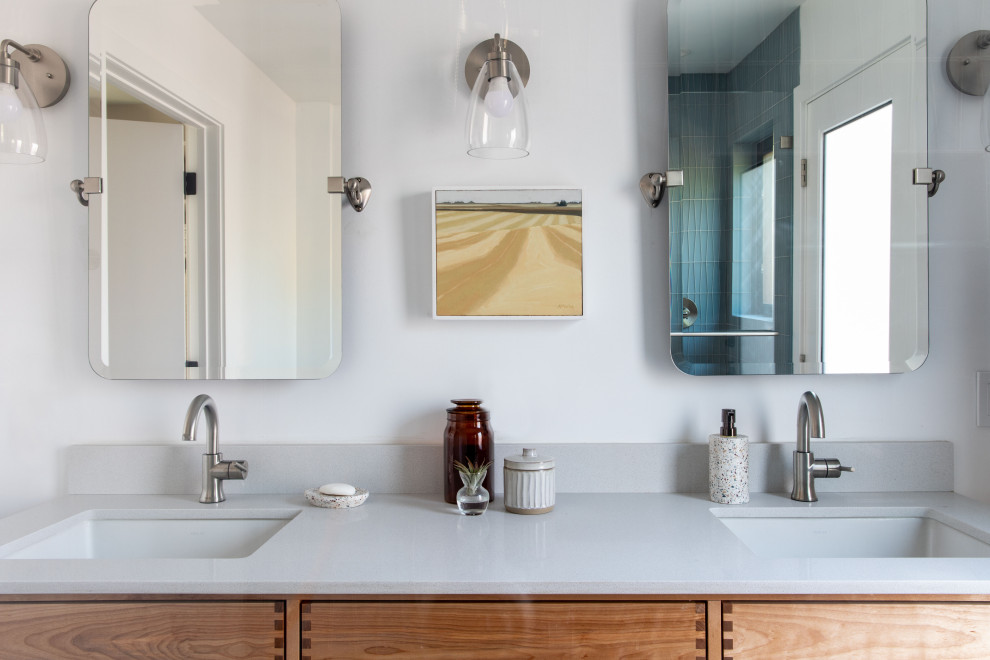 This is an example of a mid-sized midcentury master bathroom in San Francisco with beaded inset cabinets, light wood cabinets, a double shower, a one-piece toilet, white tile, glass tile, white walls, porcelain floors, a drop-in sink, engineered quartz benchtops, grey floor, a hinged shower door, white benchtops, a double vanity and a floating vanity.