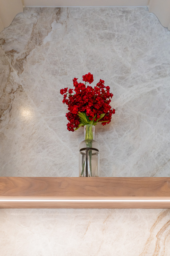 Example of a large transitional medium tone wood floor and brown floor open concept kitchen design with a double-bowl sink, flat-panel cabinets, white cabinets, quartzite countertops, beige backsplash, stainless steel appliances, an island and beige countertops