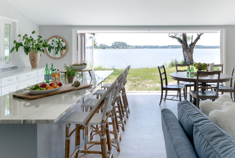 Riverside cottage kitchen with retractable doors