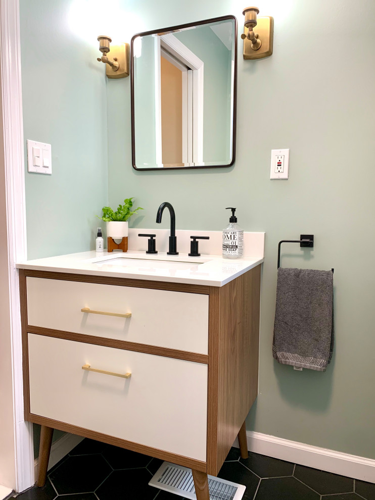 Design ideas for a small contemporary master bathroom in New York with flat-panel cabinets, white cabinets, an alcove tub, a shower/bathtub combo, a one-piece toilet, white tile, ceramic tile, green walls, ceramic floors, an undermount sink, engineered quartz benchtops, black floor, a shower curtain, white benchtops, a niche, a single vanity and a freestanding vanity.