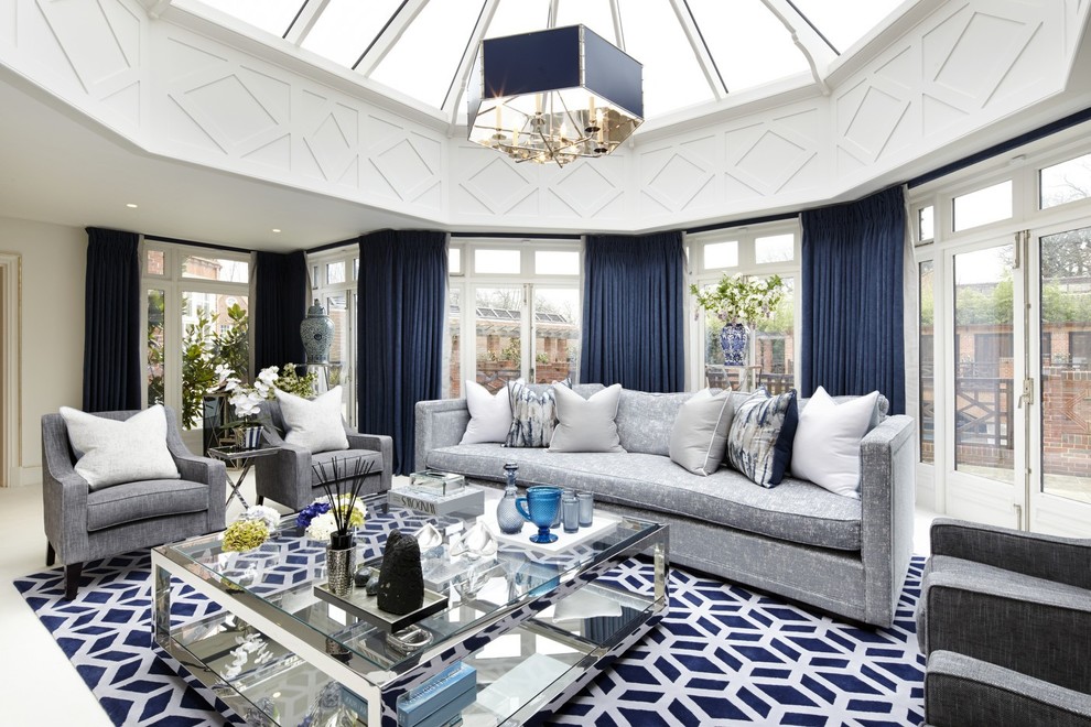 Design ideas for a large transitional formal enclosed living room in Surrey with white walls and white floor.