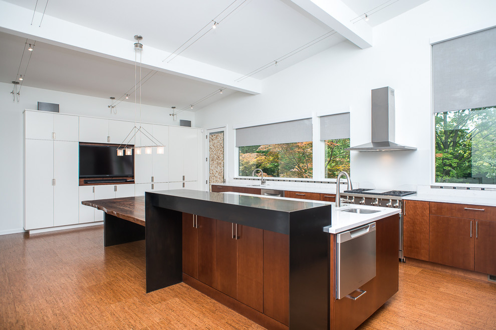 This is an example of a large asian l-shaped eat-in kitchen in Detroit with a double-bowl sink, flat-panel cabinets, medium wood cabinets, quartzite benchtops, white splashback, stone slab splashback, stainless steel appliances, cork floors and with island.