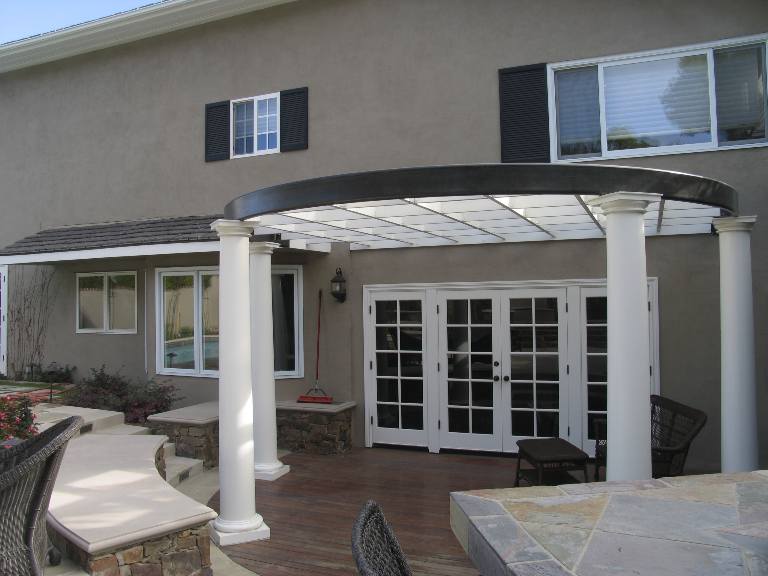 ipe deck with seat walls and overhead arbor