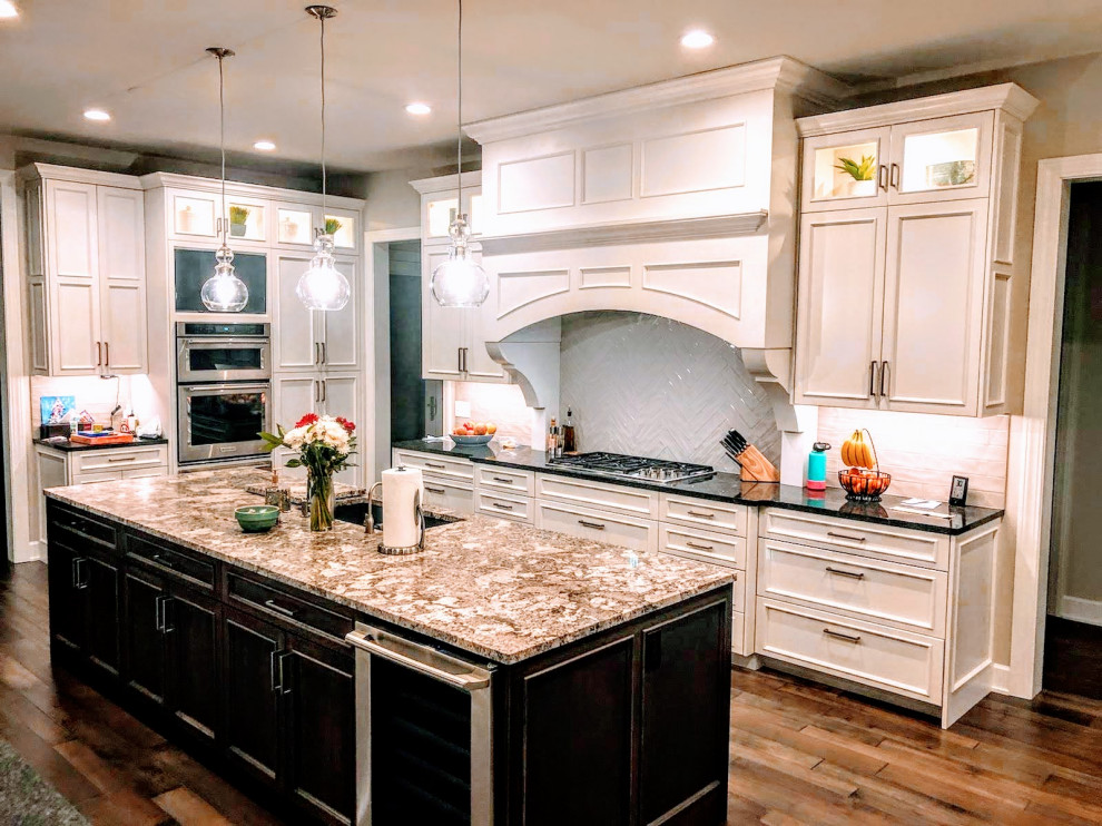 Huge transitional u-shaped eat-in kitchen photo with recessed-panel cabinets, white cabinets, granite countertops and two islands