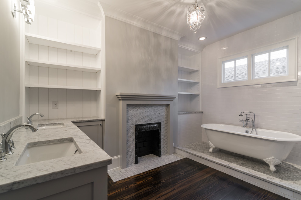 Mid-sized traditional master bathroom in Atlanta with an undermount sink, shaker cabinets, grey cabinets, marble benchtops, a claw-foot tub, an open shower, a one-piece toilet, white tile, ceramic tile, grey walls and dark hardwood floors.