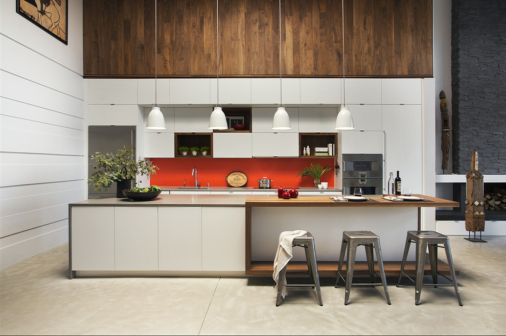 Inspiration for a contemporary single-wall open plan kitchen in Boston with flat-panel cabinets, white cabinets, wood benchtops, stainless steel appliances, with island and orange splashback.