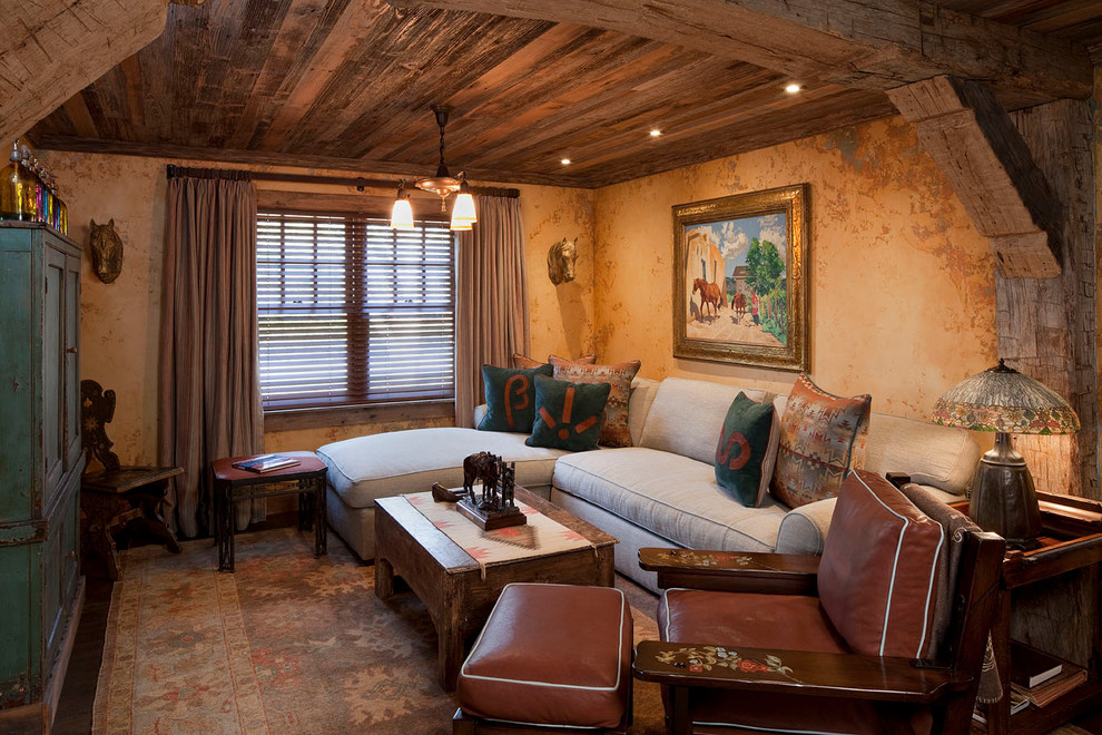 Inspiration for a country enclosed family room in Austin with beige walls.