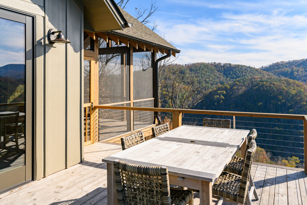 Transitional backyard deck photo with no cover