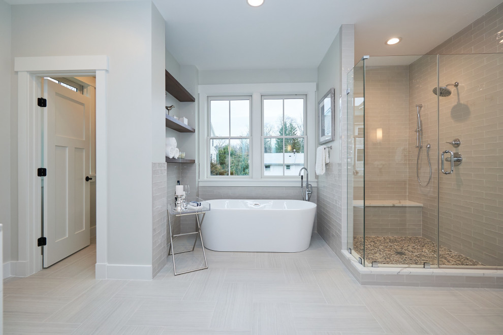 Freestanding bathtub - large transitional gray tile and ceramic tile porcelain tile, gray floor and double-sink freestanding bathtub idea in DC Metro with shaker cabinets, white cabinets, a two-piece toilet, white walls, an undermount sink, quartz countertops, a hinged shower door, white countertops and a built-in vanity
