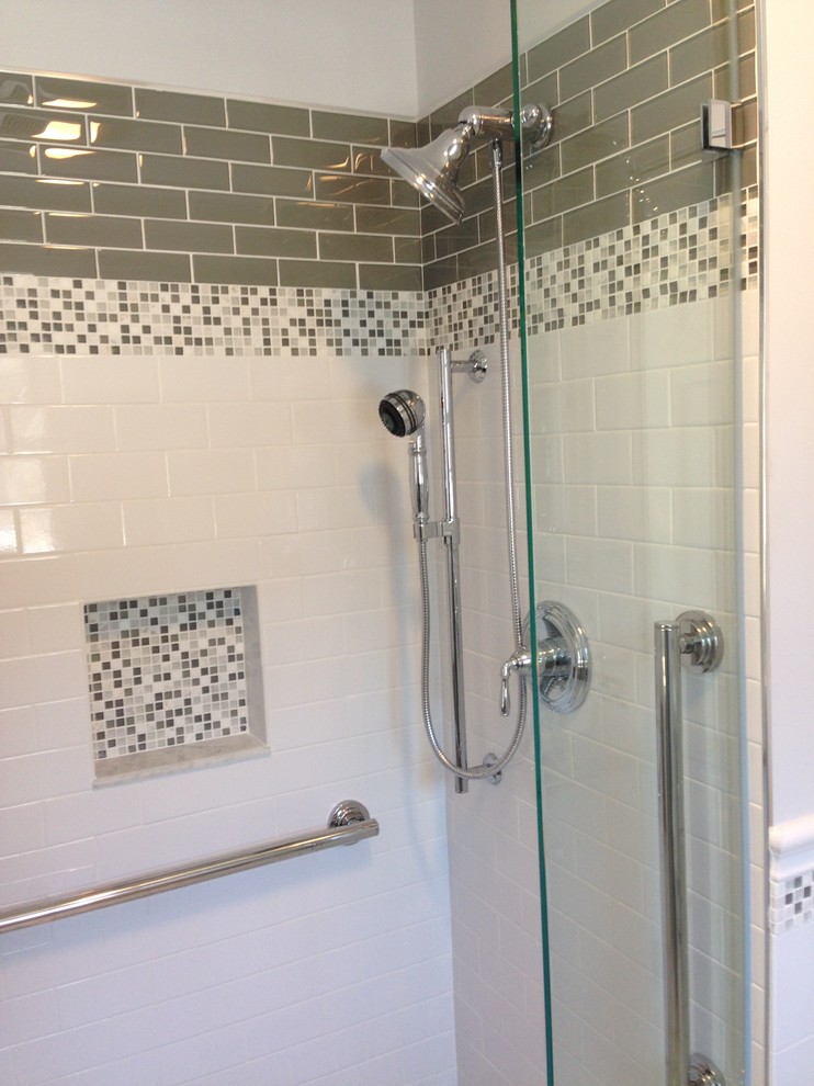 This is an example of a mid-sized modern master bathroom in Boston with white floor, an alcove shower, a two-piece toilet, beige tile, glass tile, white walls, mosaic tile floors and a pedestal sink.