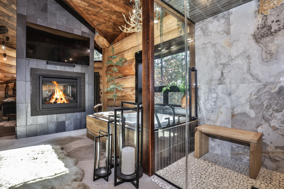 Example of a mid-sized mountain style master gray tile and ceramic tile gray floor, vaulted ceiling and wood wall drop-in bathtub design with a hinged shower door