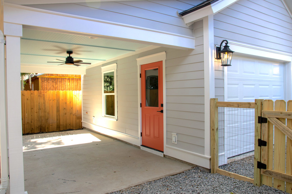 Inspiration for a mid-sized coastal detached one-car carport remodel in Charleston