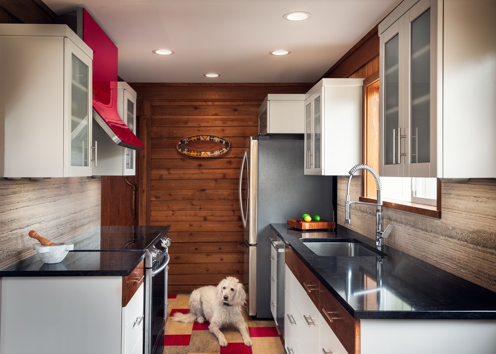 Design ideas for a country galley separate kitchen in Portland with quartz benchtops, stone slab splashback, linoleum floors, an undermount sink, glass-front cabinets, white cabinets and stainless steel appliances.