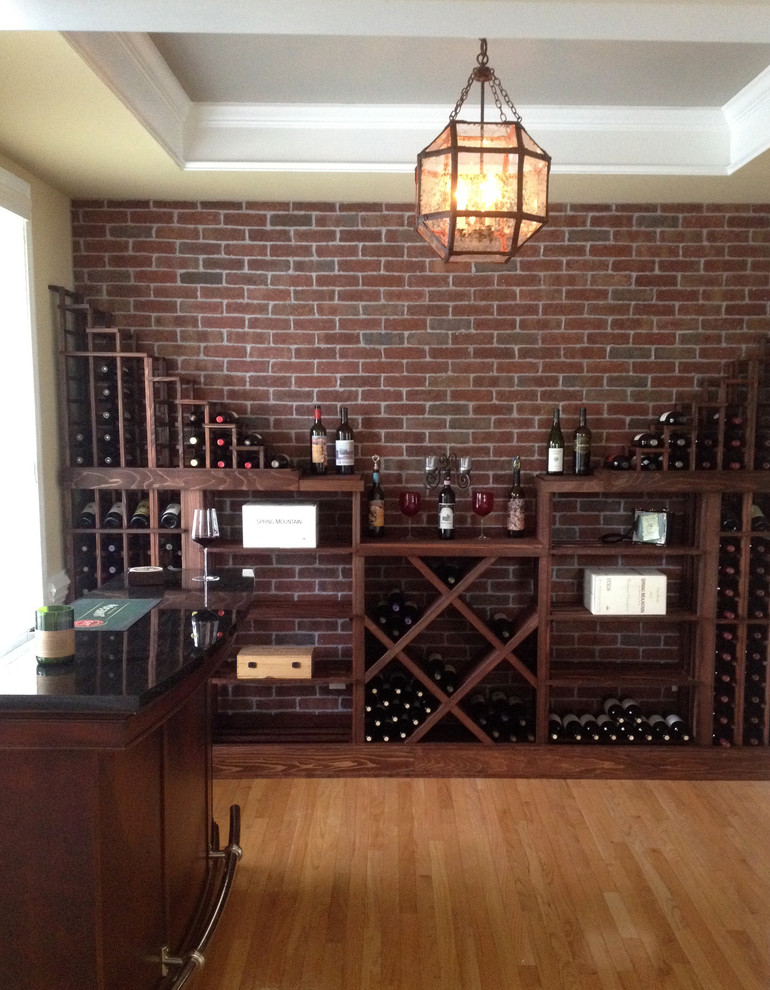 Inspiration for a small country wine cellar in Charlotte with diamond bins.