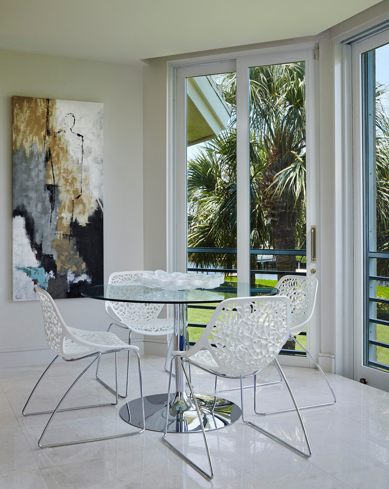 Design ideas for a modern dining room in Miami with white walls and porcelain floors.