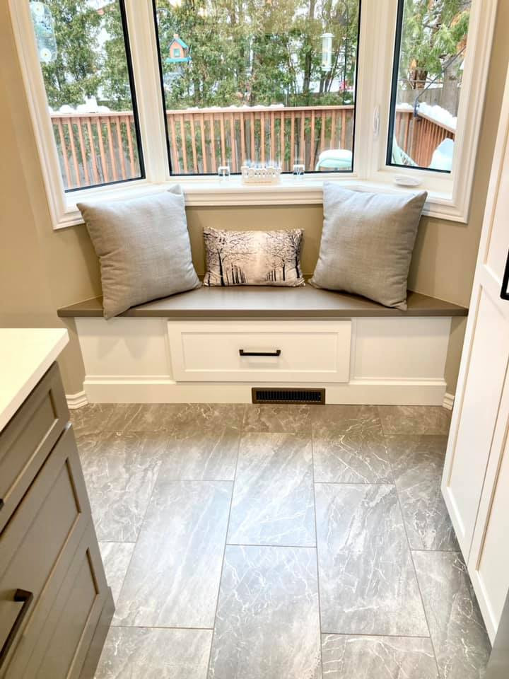 Enclosed kitchen - mid-sized transitional galley ceramic tile and gray floor enclosed kitchen idea with a double-bowl sink, shaker cabinets, white cabinets, quartz countertops, gray backsplash, ceramic backsplash, stainless steel appliances, an island and white countertops