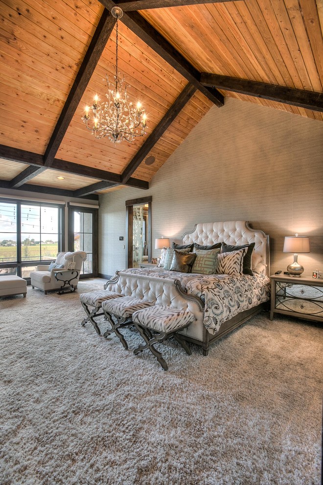 This is an example of an expansive country master bedroom in Denver with beige walls, carpet and no fireplace.