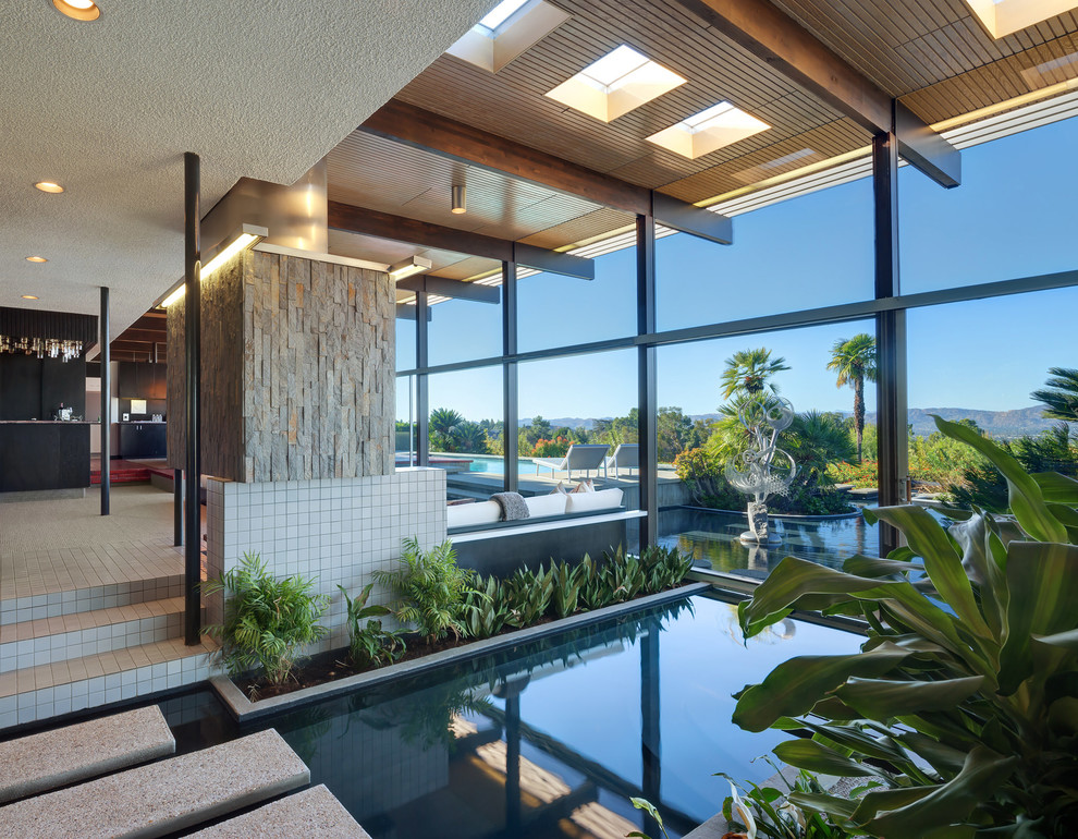 Inspiration for a large midcentury indoor pool in Los Angeles.