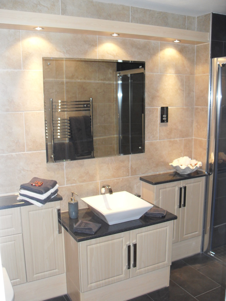 This is an example of a modern bathroom in Other with raised-panel cabinets, light wood cabinets, a curbless shower, a wall-mount toilet and solid surface benchtops.