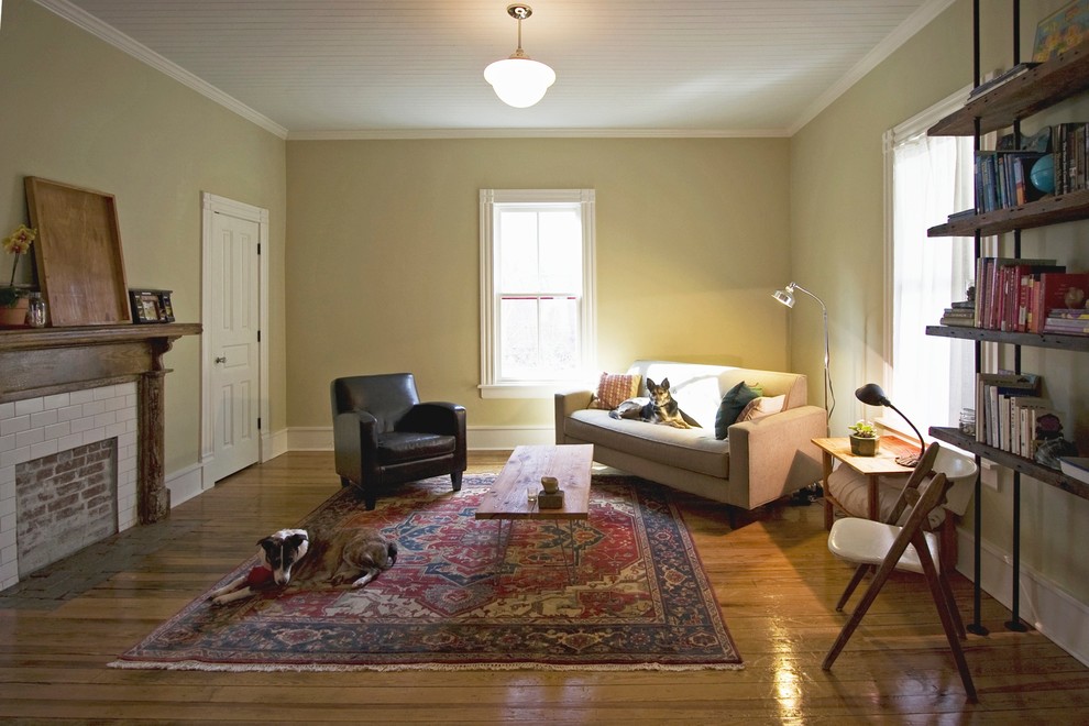 Photo of a mid-sized traditional living room in Raleigh with beige walls and medium hardwood floors.