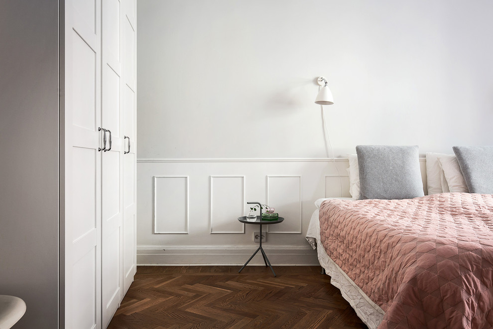 Inspiration for a mid-sized traditional master bedroom in Stockholm with grey walls.