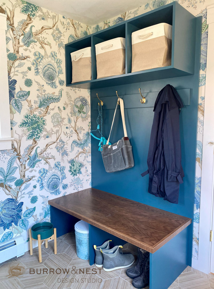 This is an example of a country utility room in Providence with a farmhouse sink, turquoise cabinets, quartzite benchtops, a side-by-side washer and dryer, beige benchtop and wallpaper.