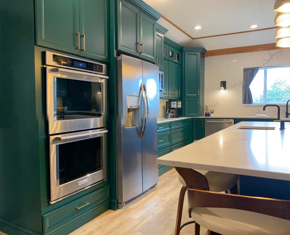 This is an example of a large arts and crafts eat-in kitchen in Other with raised-panel cabinets, marble benchtops, white splashback, marble splashback, stainless steel appliances, light hardwood floors and grey benchtop.
