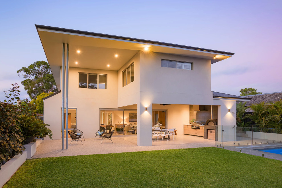 Mid-sized contemporary two-storey white house exterior in Perth with wood siding, a hip roof and a metal roof.
